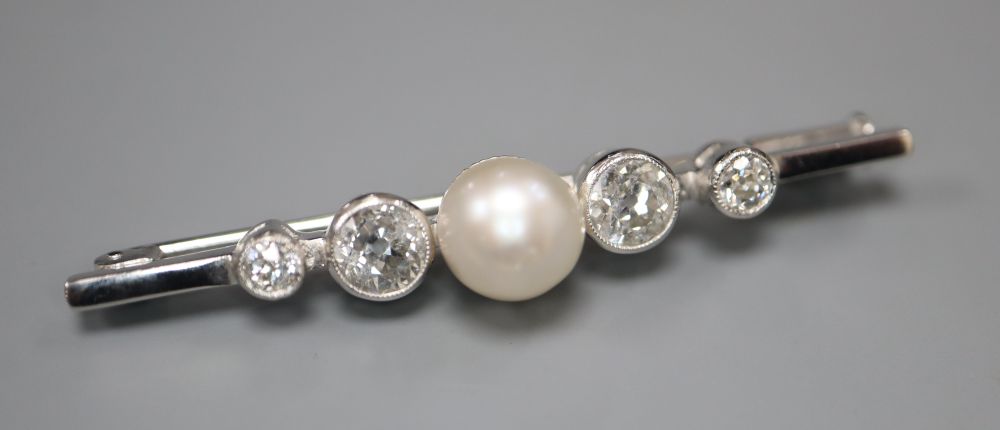 A white metal single stone cultured pearl and four stone diamond set bar brooch, 48mm, gross 4.9 grams.